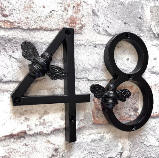 A picture of Brass Bee house numbers.