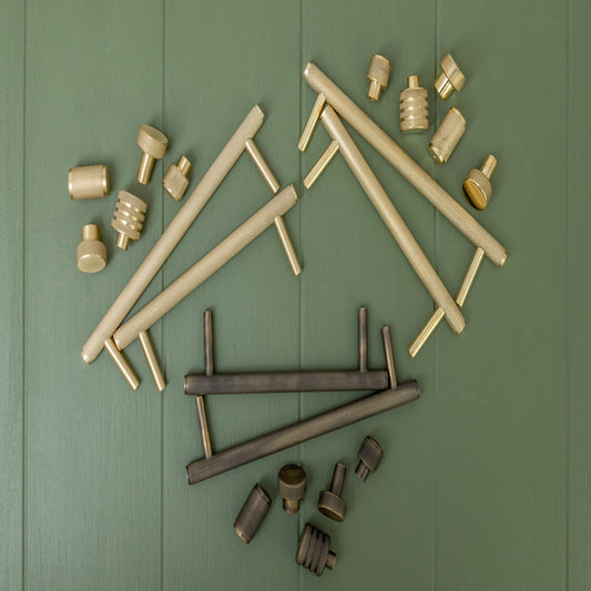 A picture of Brass Bee cabinet handles.