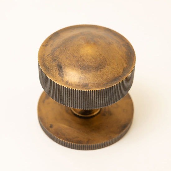 Straight Knurled Design Solid Brass Centre Door Knob - Brass bee
