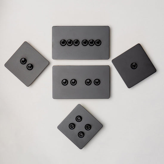Foundry Series Knurled Toggle Switch and Sockets – Matte Black - Brass bee