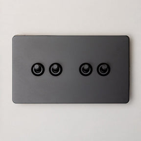 Foundry Series Knurled Toggle Switch and Sockets – Matte Black - Brass bee