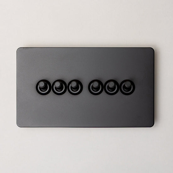 Foundry Series Knurled Toggle Switch and Sockets – Matte Black - Brass bee