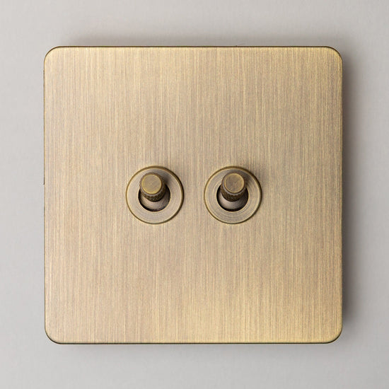 Foundry Series Knurled Toggle Switches and Sockets – Antique Brass - Brass bee