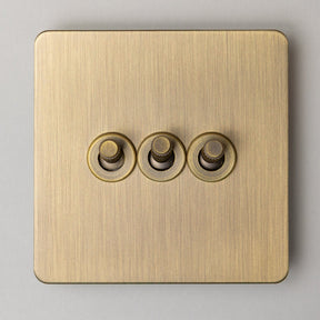 Foundry Series Knurled Toggle Switches and Sockets – Antique Brass - Brass bee