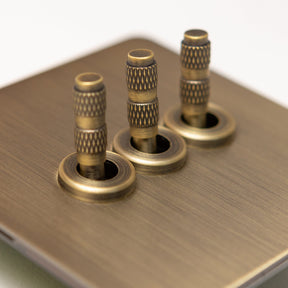 Foundry Series Knurled Toggle Switches and Sockets – Antique Brass - Brass bee