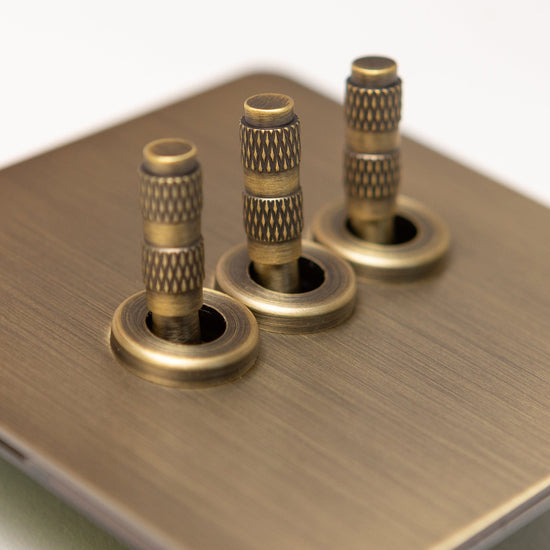 Foundry Series Knurled Toggle Switches and Sockets – Antique Brass - Brass bee