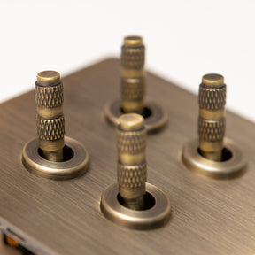Foundry Series Knurled Toggle Switches and Sockets – Antique Brass - Brass bee