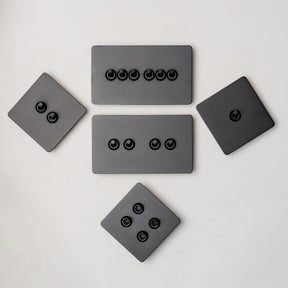 Foundry Series Knurled Toggle Switch and Sockets – Matte Black - Brass bee