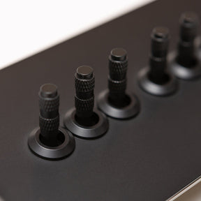 Foundry Series Knurled Toggle Switch and Sockets – Matte Black - Brass bee