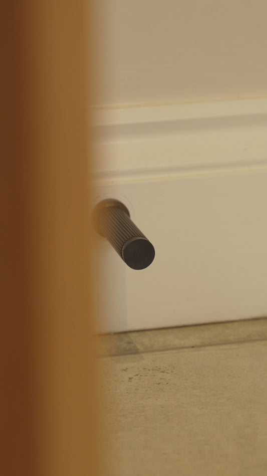 Straight Knurled Door Stop - Antique Brass - Solid Brass
